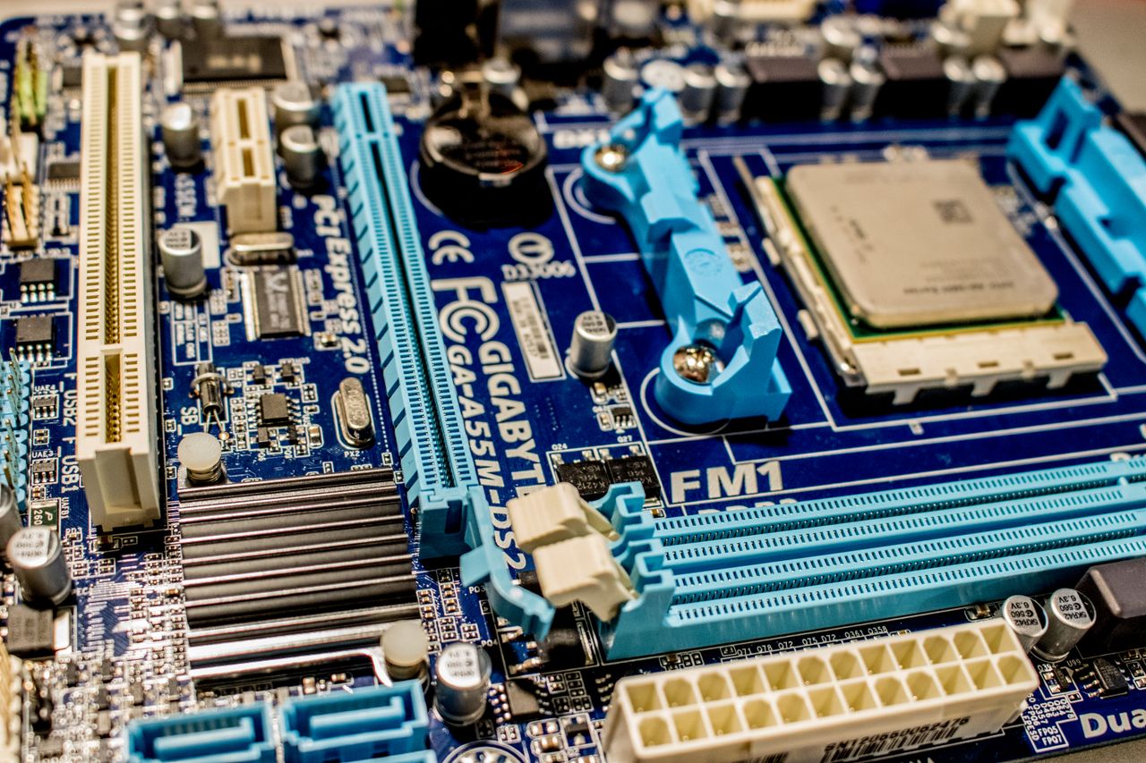 our-story Detailed close-up image of a computer motherboard showcasing various electronic components.