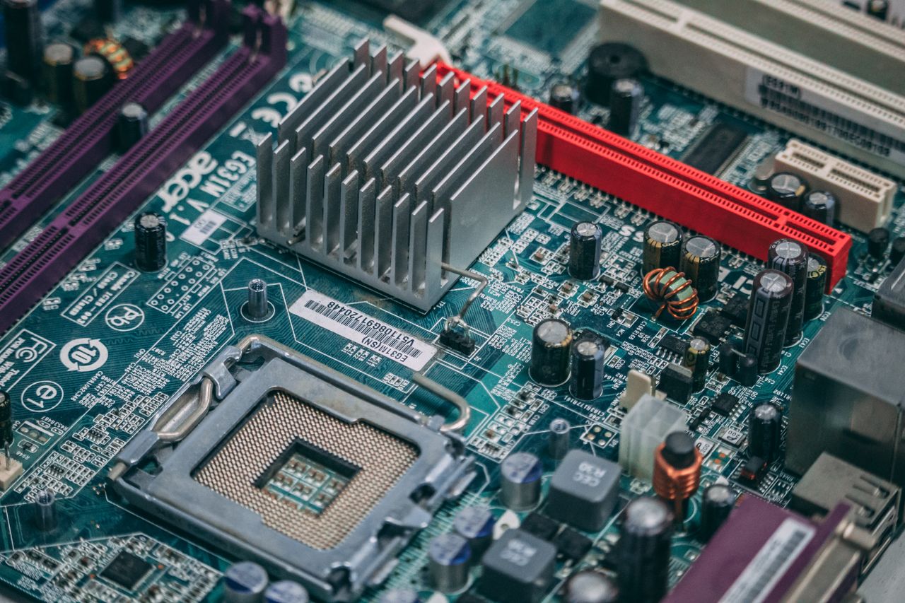 about-us Detailed image of a modern computer motherboard showcasing components and circuits.
