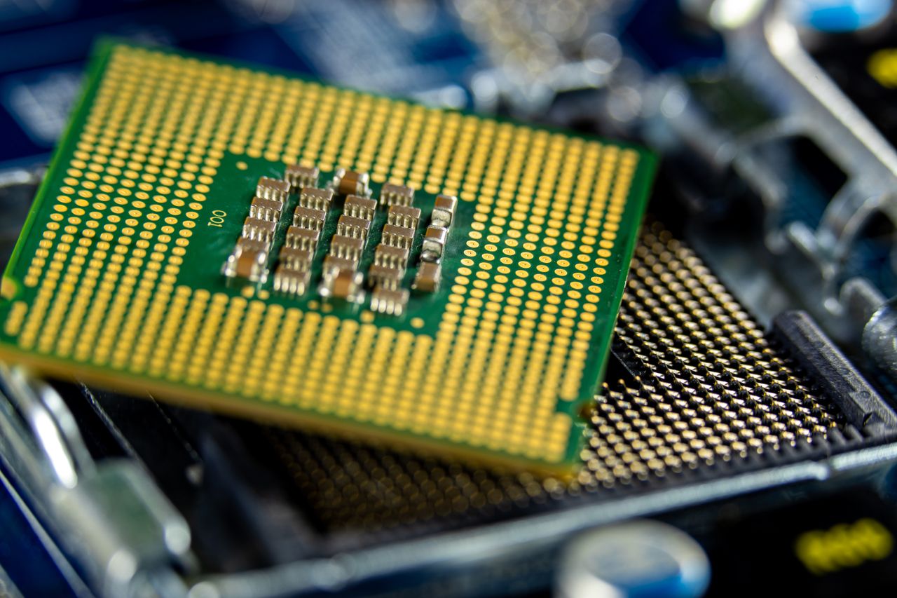 who-we-are Detailed close-up of a microprocessor on a motherboard showcasing its intricate design.