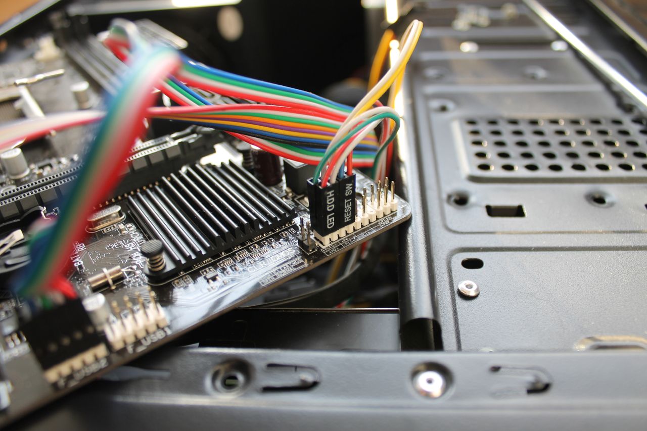 Mastering the First Impression: Your intriguing post title goes here Close-up view of a motherboard with colorful wires and electronic components, showcasing intricate details.